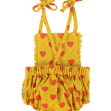 Baby playsuit | mustard w/ red hearts allover