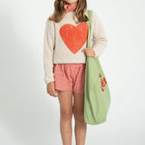 Unisex ecru knitted sweater with red heart