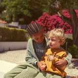 Unisex washed green terry sweatshirt with “best friend” print