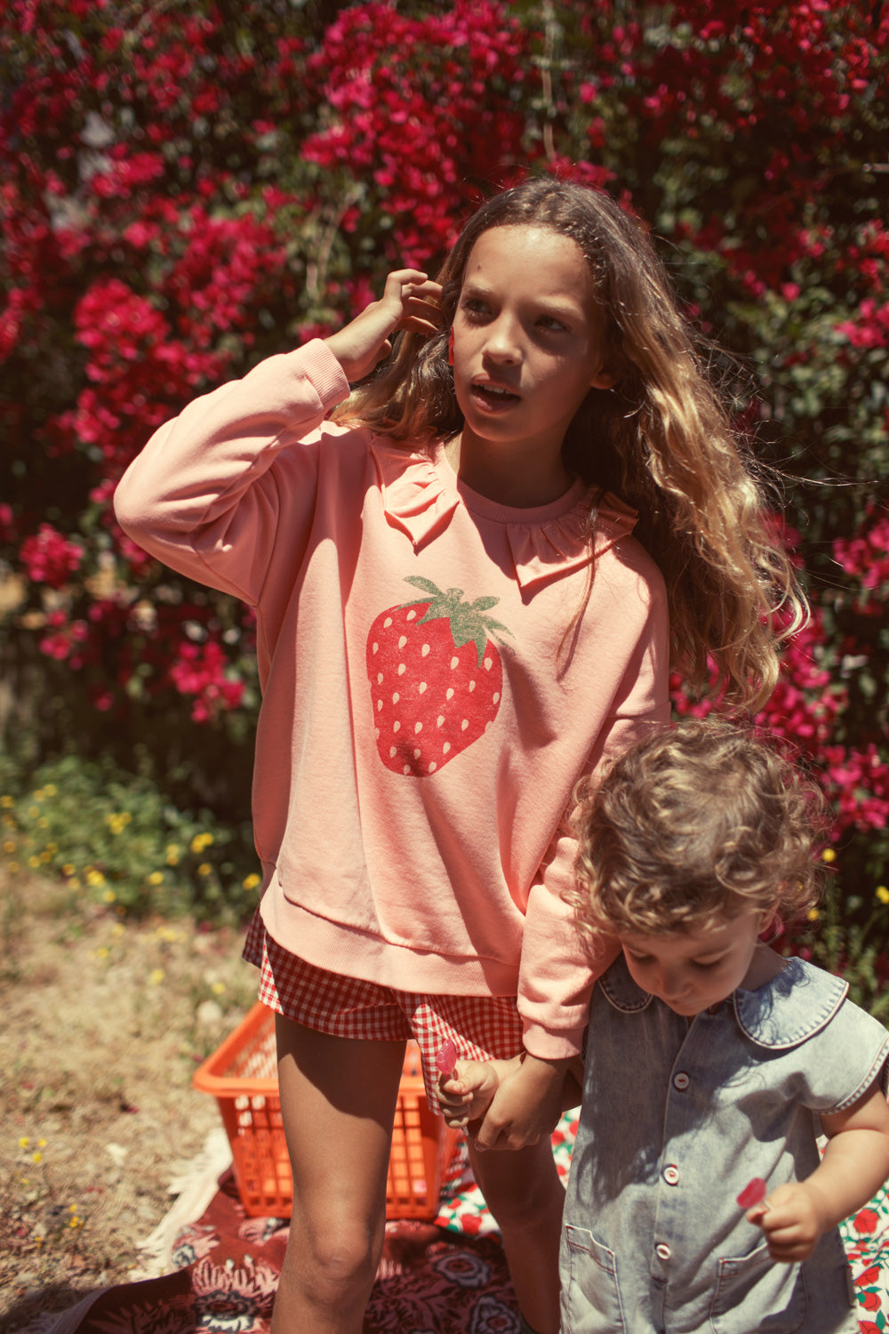 Girl light pink sweatshirt with strawberry print