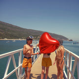shorts w/ fringes | mustard w/ red hearts allover