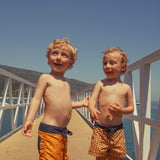 Boy Swim Shorts in Animal Print – Mustard