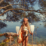 Girl ecru bikini with black hearts and ruffles