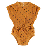 baby playsuit | camel w/ black hearts allover